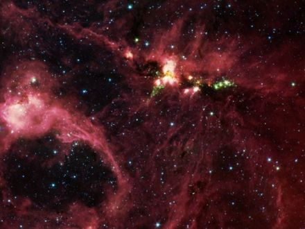 Stellar Nursery DR21
The stellar nursery DR21 is shrouded in so much space dust that no visible light escapes it. By seeing in the infrared, NASA's Spitzer Space Telescope has managed to pull this veil aside. Photo Credit: NASA/JPL/Caltech
